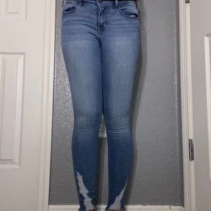Distressed ripped skinny leg jeans